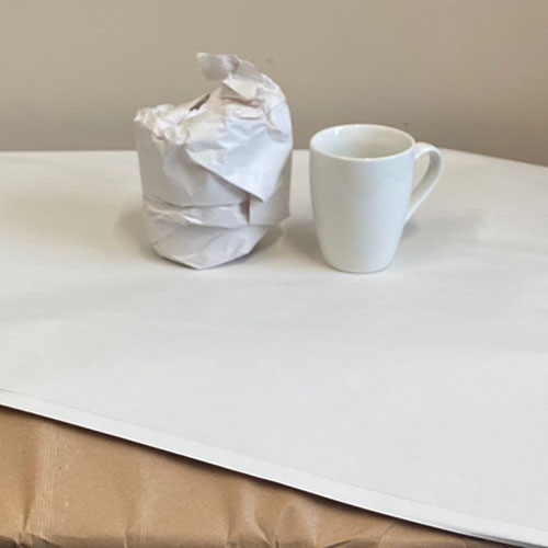 packing paper protecting a mug, as supplied by Pooley Removals